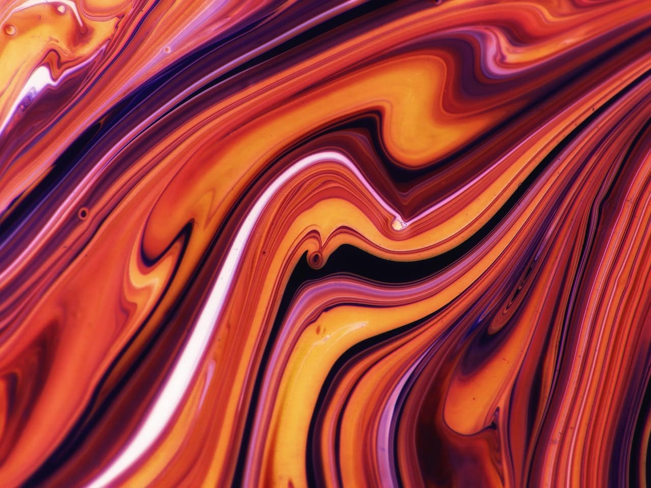 Abstract red, orange, and burgundy color swirls.
