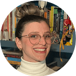 Headshot of smiling woman against a background of books