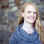Dr. Amy Collier, a white woman, smiling against a brick background