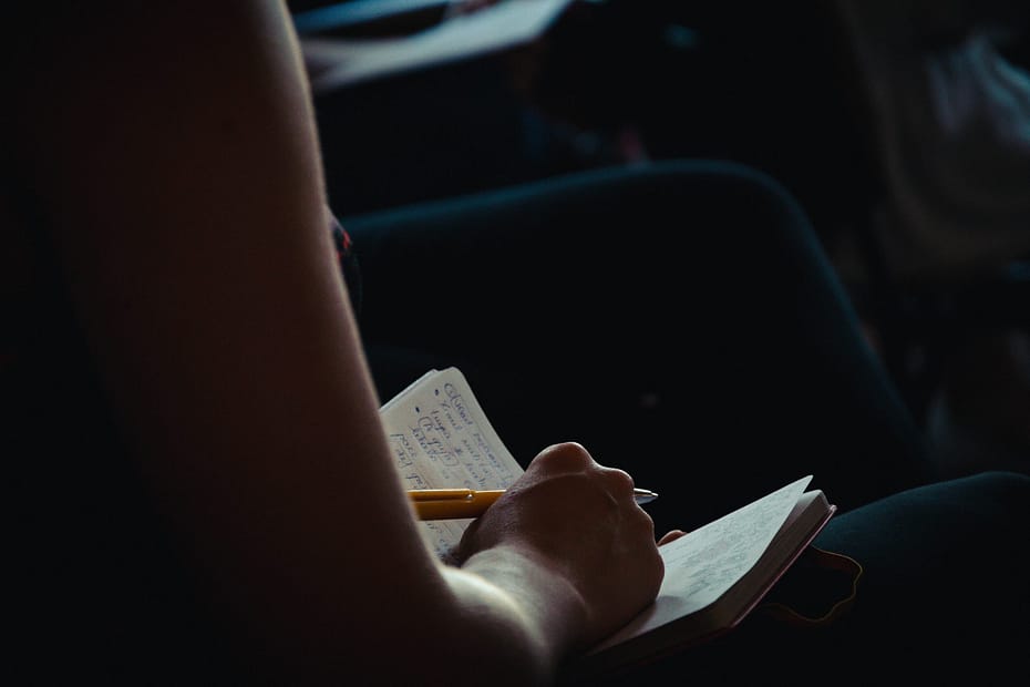 Over the shoulder shot of a person writing